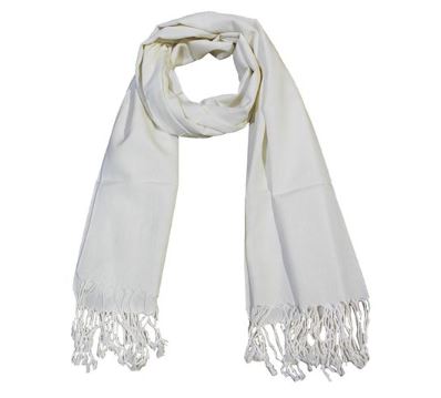 A cream colored long scarf looped at the top with fringe at each end that would make a good holiday gift.