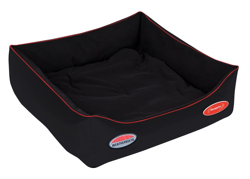 The Therapy-Tec Dog Bed is shown. It is a square black bed with four sides and red trim. It is shown against a white background.