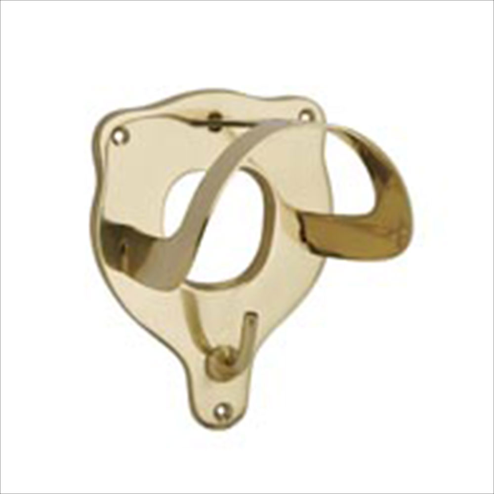 A brass colored metal bridle rack