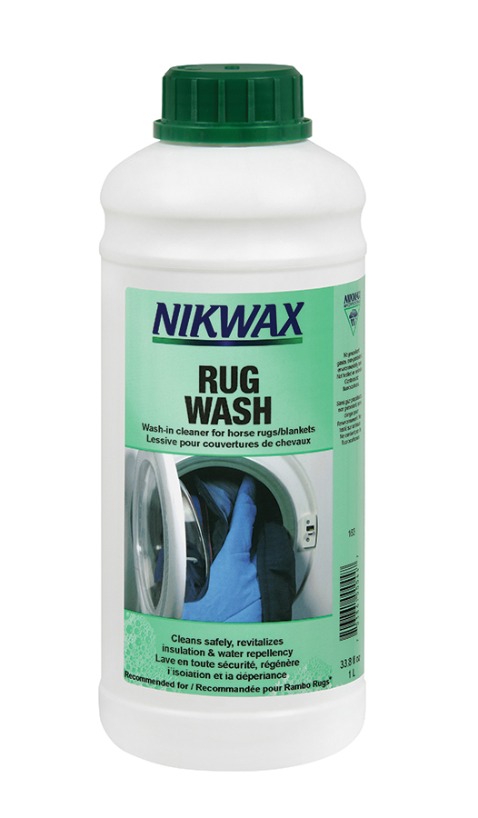 A white bottle of Nikwax Rug Wash with a green top and label.
