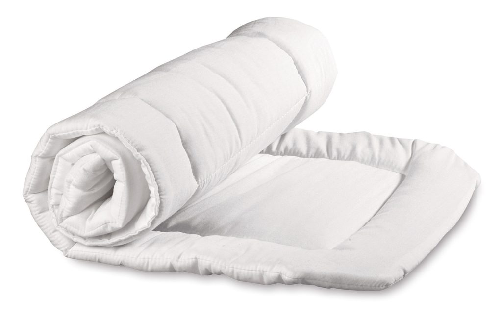 A picture of a white roll of quilted cotton and fabric against a white background.