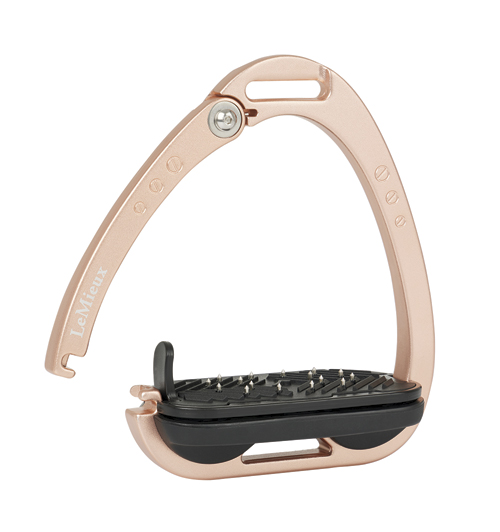 The LeMieux Vector Control Stirrup. The Stirrup part is rose gold and the left side demonstrates the stirrups ability to disconnect from the foot treat at the bottom to release the rider's foot. The foot dread is black.